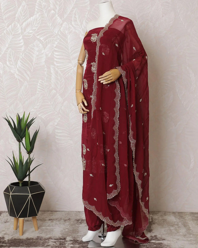 Ruby red silk crepe kameez with gold embroidery, sequins and bead work in floral design. Ruby red plain salwar with same tone flat chiffon dupatta having gold embroidery and mirror work-D15530 Regal Fabrics