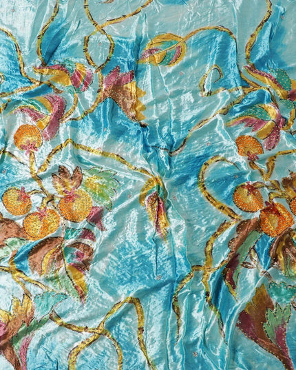 Arctic blue to sky blue Rayon velvet fabric with multicolor print having yellow and green stonework in leaf design