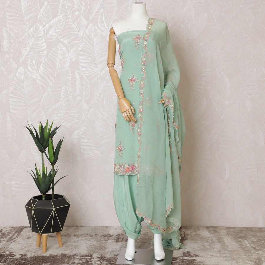 Mint green silk crepe kameez with gold embroidery, sequins and bead work in floral design. Mint green plain salwar with same tone flat chiffon dupatta having gold embroidery and mirror work-D15528