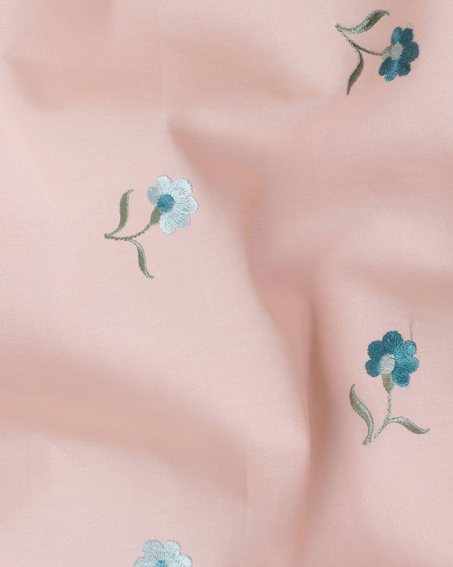 Peach cotton voile fabric with sapphire blue, olive green and powder blue embroidery in floral design-D11086