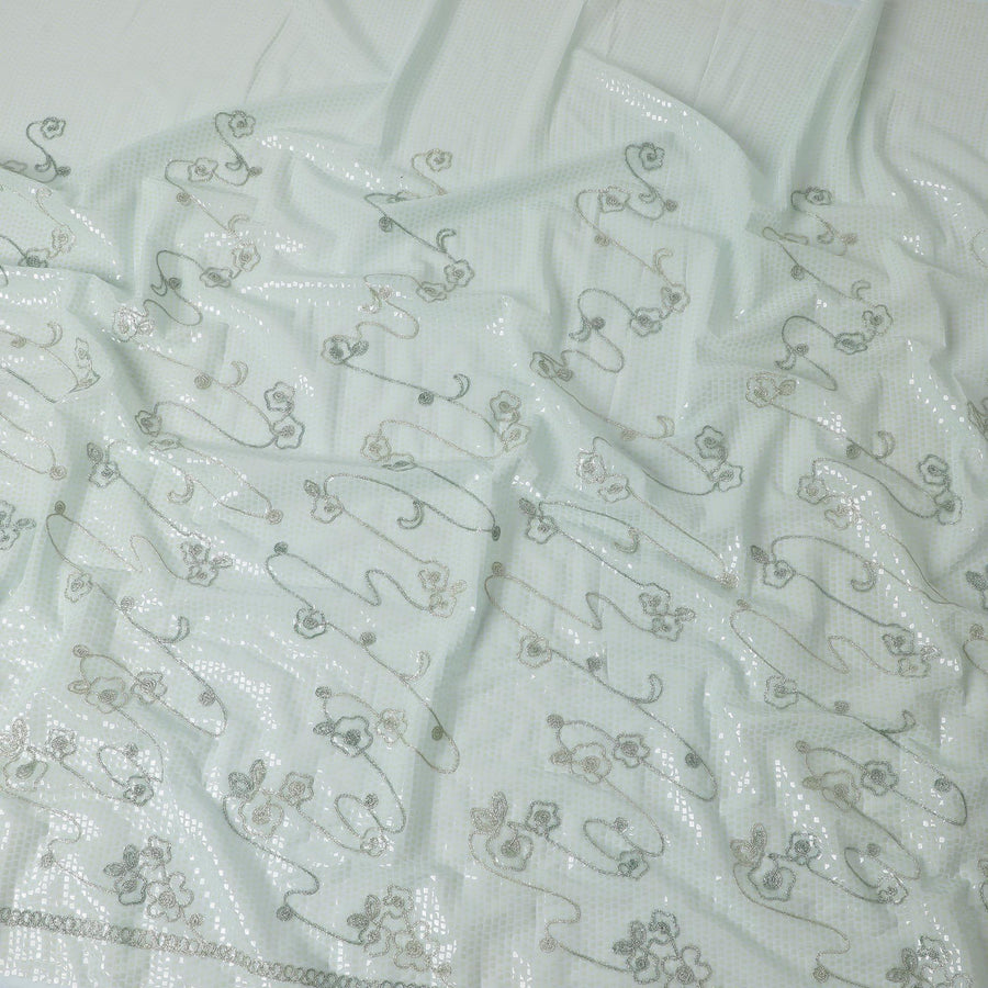 Teal Green georgette fabric with same color appliques and see through laminates in abstract design