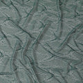 Emerald green and gold metallic lace fabric in abstract design