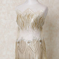 Gold nylon tulle fabric with  same tone, off white embroidery having stone work in abstract design-D14422