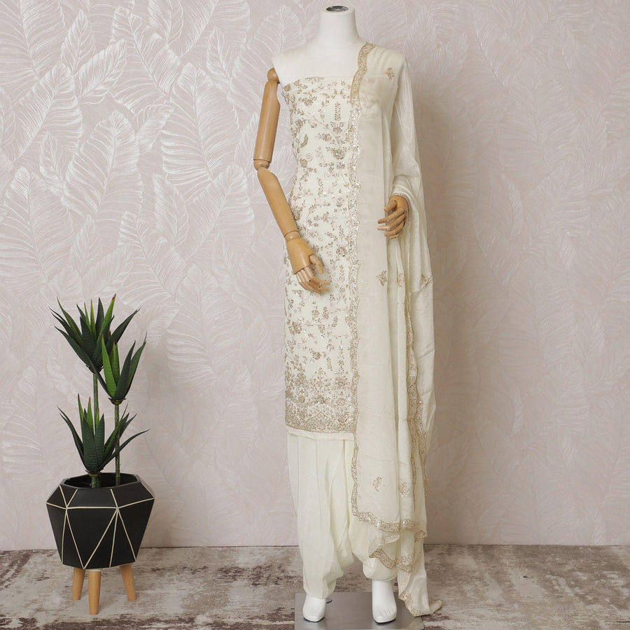 Cream Premium pure silk crepe kameez with gold embroidery, bead work, sequin work in floral design. Ceram Plain salwar with same tone chiffon dupatta having  gold embroidery and bead work-D15573