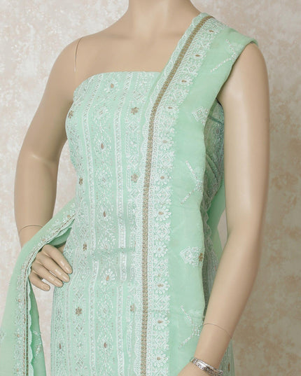 Turquoise green synthetic georgette kameez with same tone, gold embroidery having sequins in floral design. Turquoise green plain salwar with same tone chiffon dupatta having gold embroidery-D12633