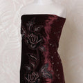 Dark maroon silk blended velvet fabric with same tone embroidery, black flock having stone work in fancy design-D15093