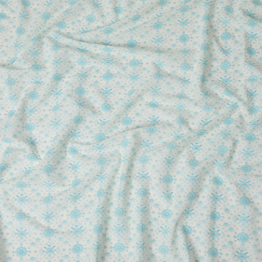Off white cotton voile fabric with baby blue print in floral design-D15060