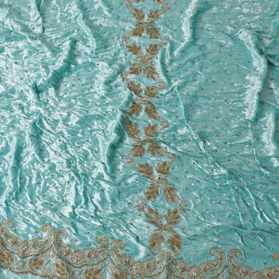 Arctic blue Rayon velvet fabric with metallic silver zardozi work, green , white and  orange stone work, green beads in fancy design
