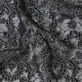 Black nylon tulle fabric with silver embroidery in fancy design