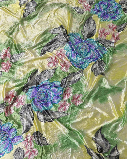 Baby yellow Rayon velvet fabric with multicolor print having silver and yellow stonework in floral design